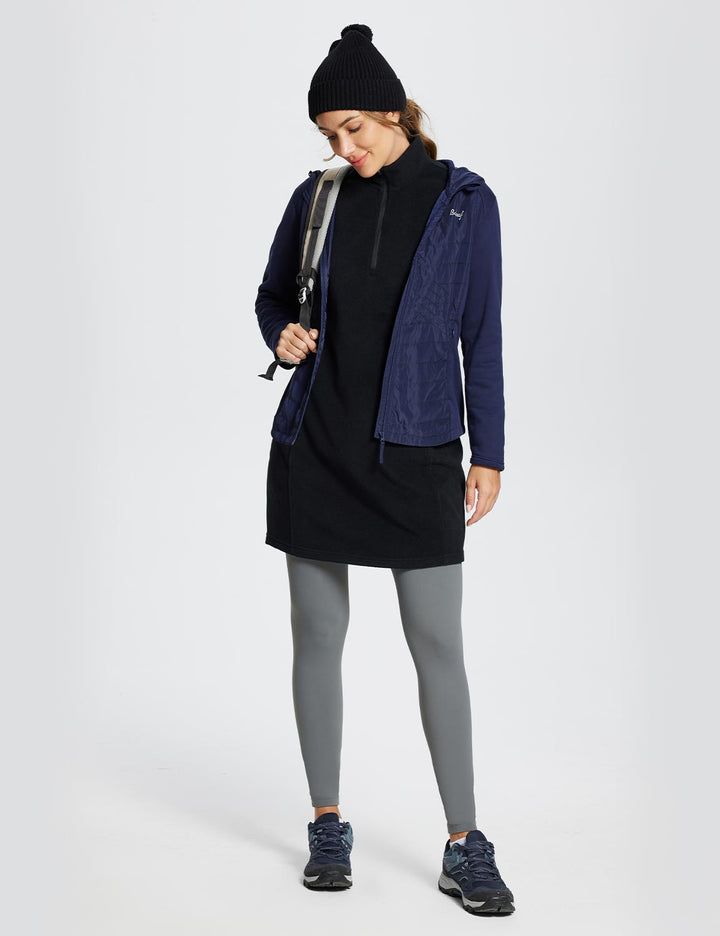 Abito invernale da donna. Tunica con collo alto, mezza zip e tasca. Stile quotidiano, comodo e trendy.