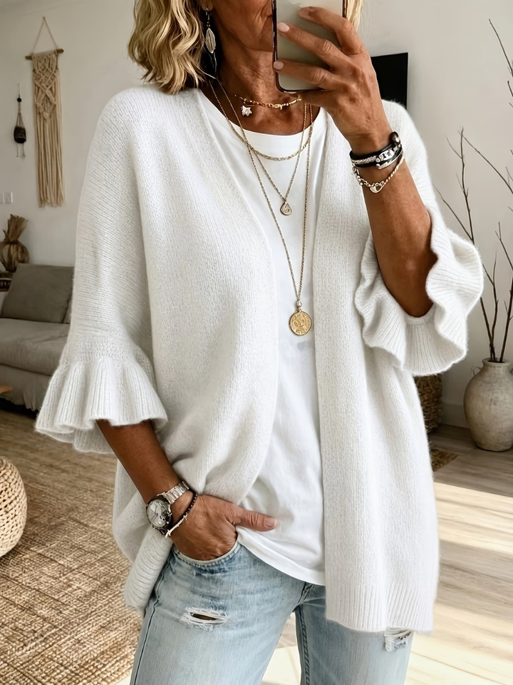 Cardigan donna aperto versatile con maniche a volant. Eleganza e comfort per look casual chic moda donna.