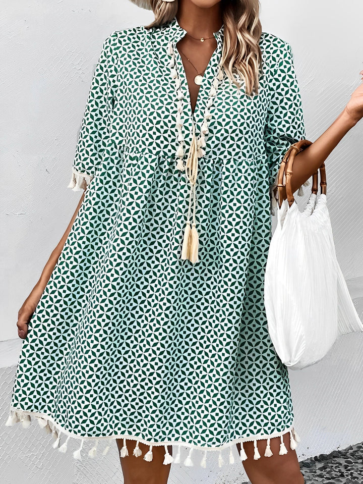 Moda mare: vestito estivo corto a pois blu da donna, con nappe e maniche corte. Ideale per vacanze.