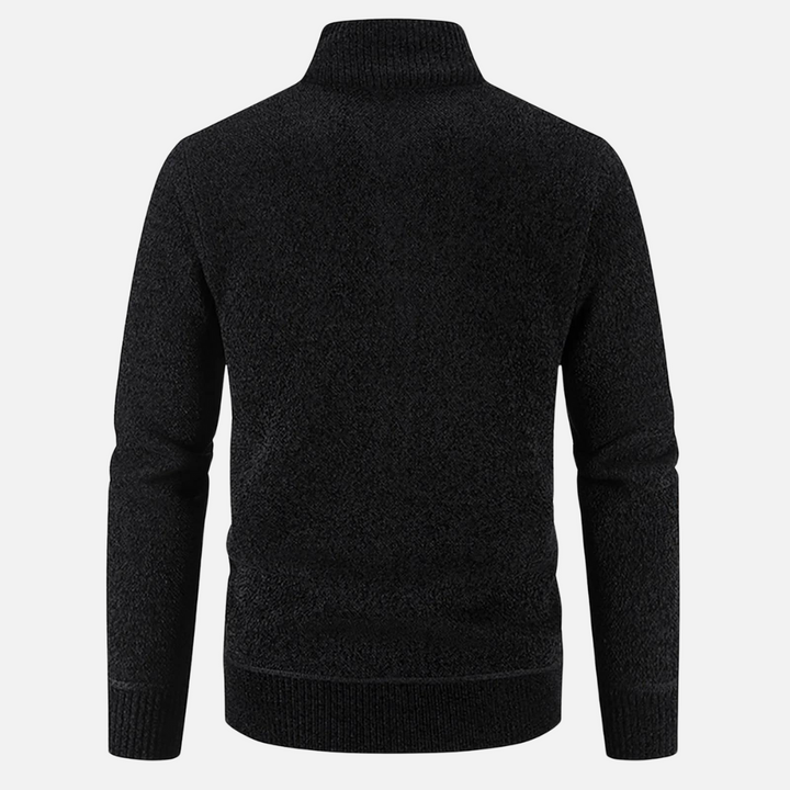 Dettaglio tessuto giacca invernale uomo, mostra la texture calda e resistente per l'abbigliamento.