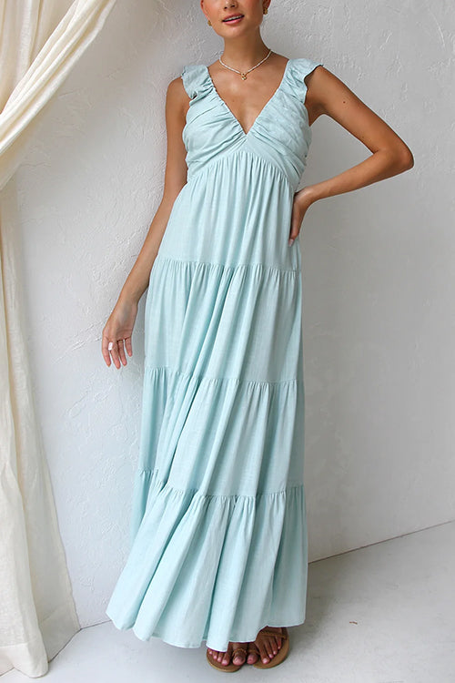 Abito lungo da donna con scollo a V e balze, senza maniche. Perfetto per un look estivo casual ed elegante.