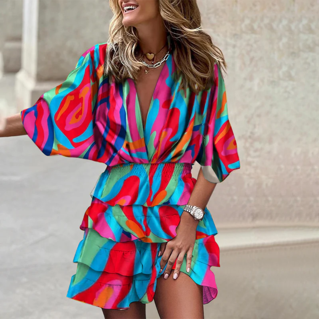 Look fresco con mini abito estivo donna. Abito boho chic con scollo a V e stampe vivaci, ideale per l'estate.