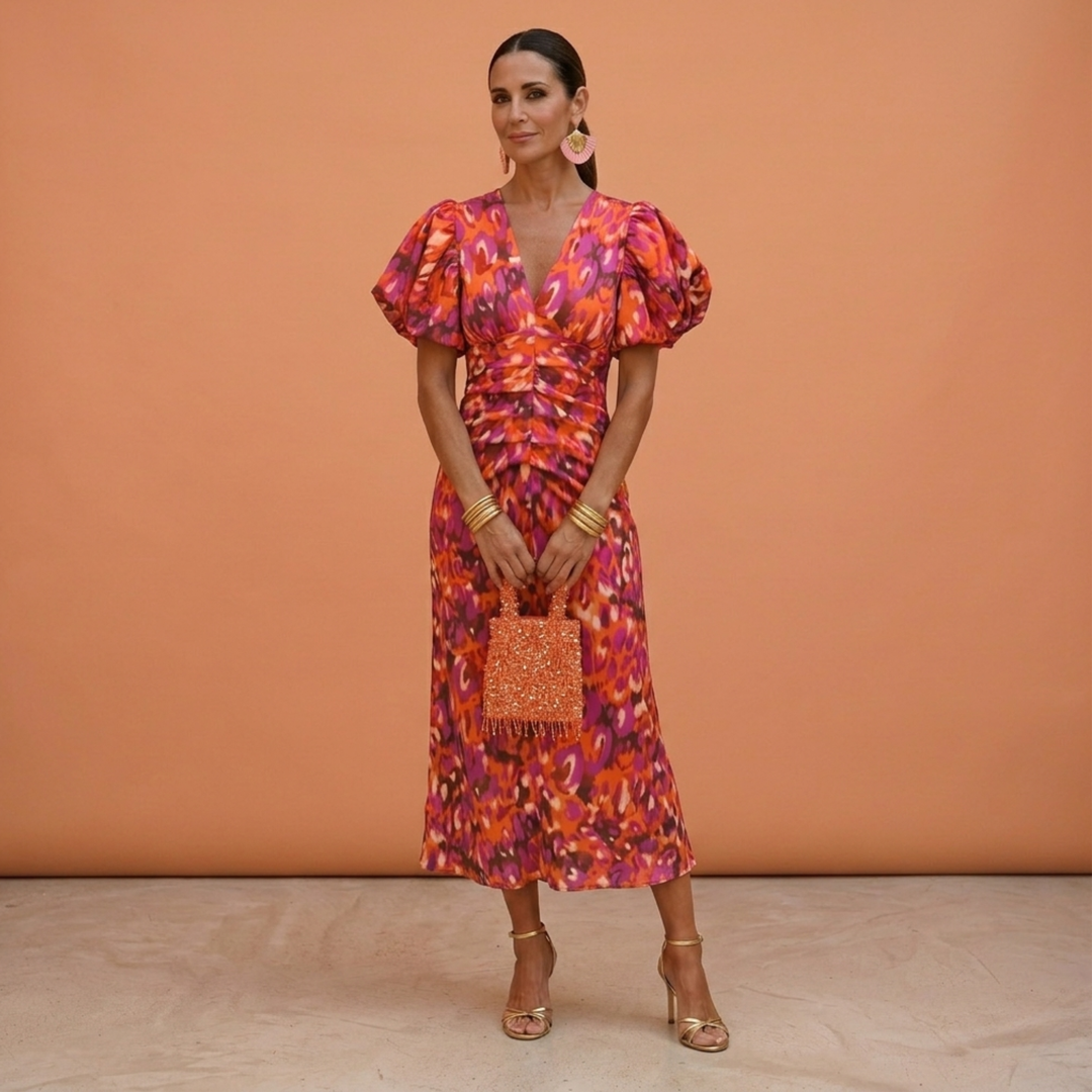 Vestito donna elegante con scollo a V e maniche a sbuffo, perfetto per primavera/estate.