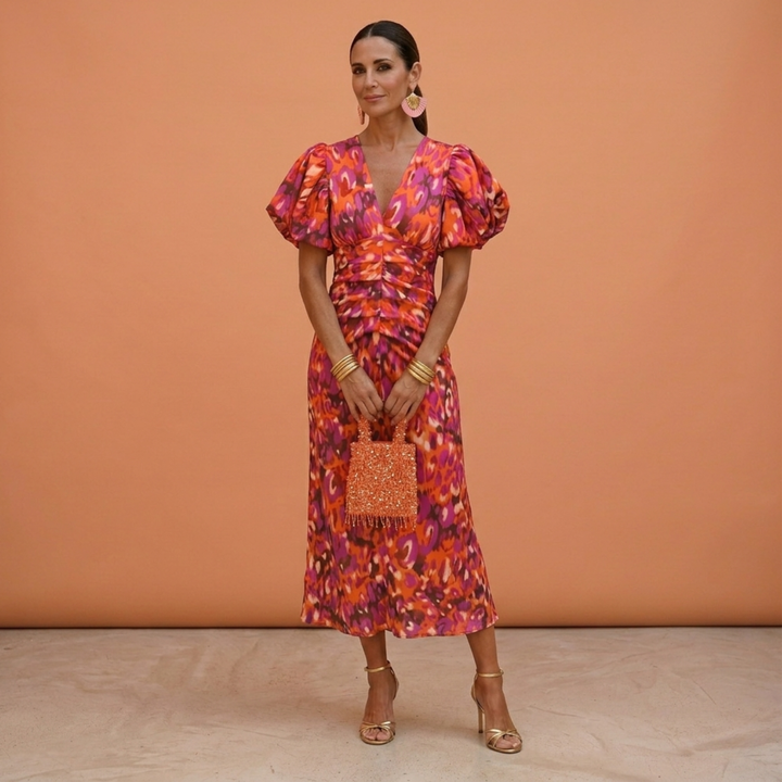 Vestito donna elegante con scollo a V e maniche a sbuffo, perfetto per primavera/estate.