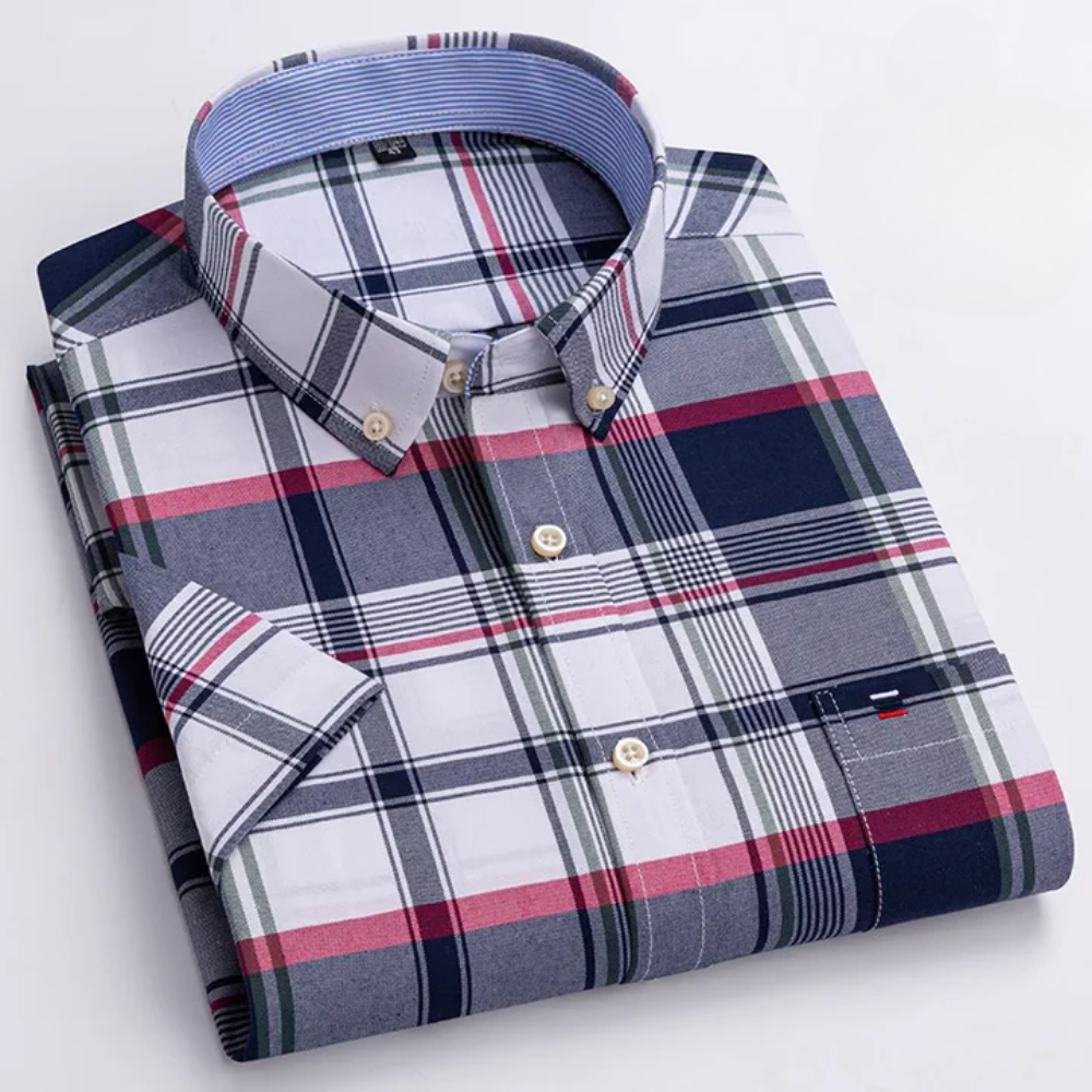 Camicia classica uomo a maniche lunghe con raffinato motivo decorativo. Eleganza versatile per ogni occasione.