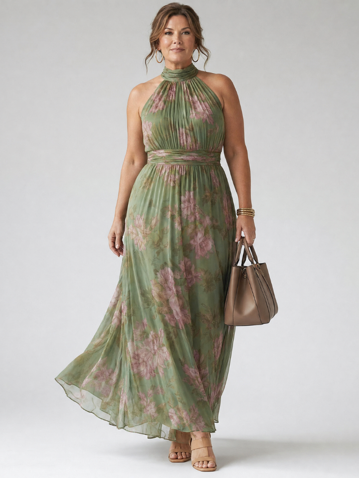 Vestito midi estivo da donna in verde salvia, con scollo halter e dettagli arricciati. Look chic e femminile.