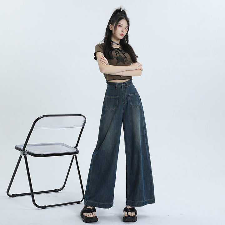 Jeans donna retrò a vita alta, gamba dritta e larga, colore blu scuro. Ideali per un look casual o elegante.