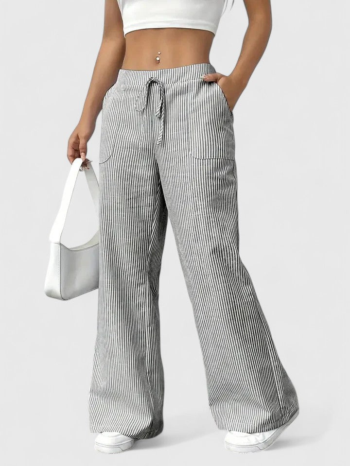 Pantaloni donna casual-chic, vita alta con laccio, gamba larga. Tessuto fluido perfetto per l'estate.