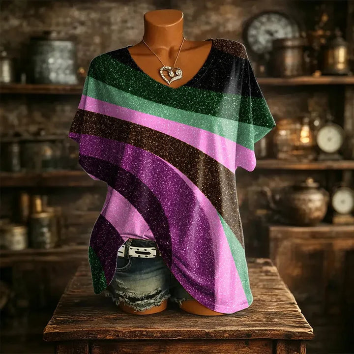 T-shirt donna comoda con fantasia vivace e scollo a V, perfetta per outfit casual e giornate estive.