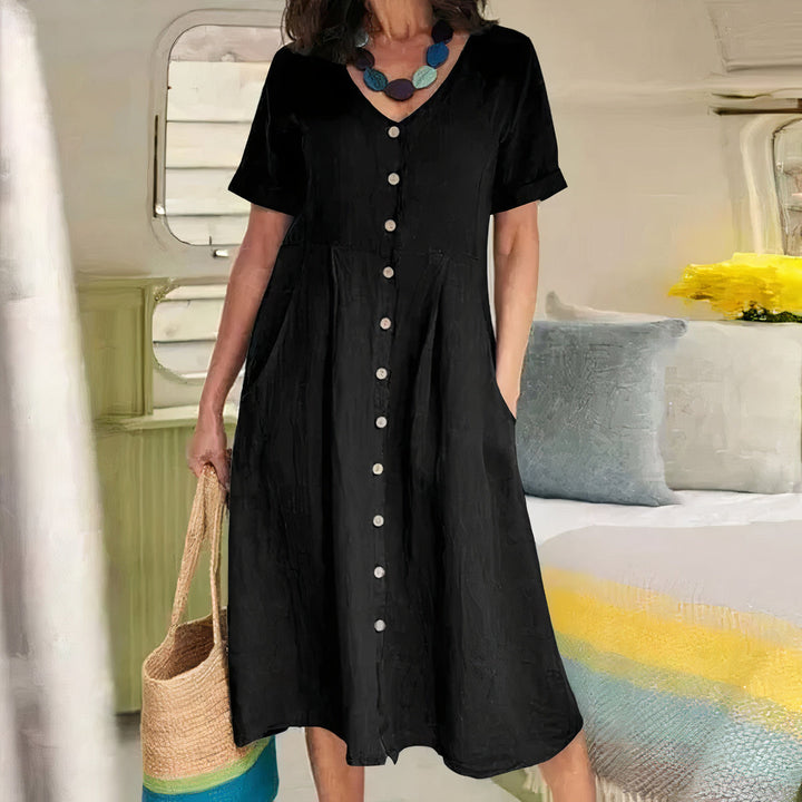 Abito estivo midi ampio con girocollo, stile casual e versatile per ogni occasione.
