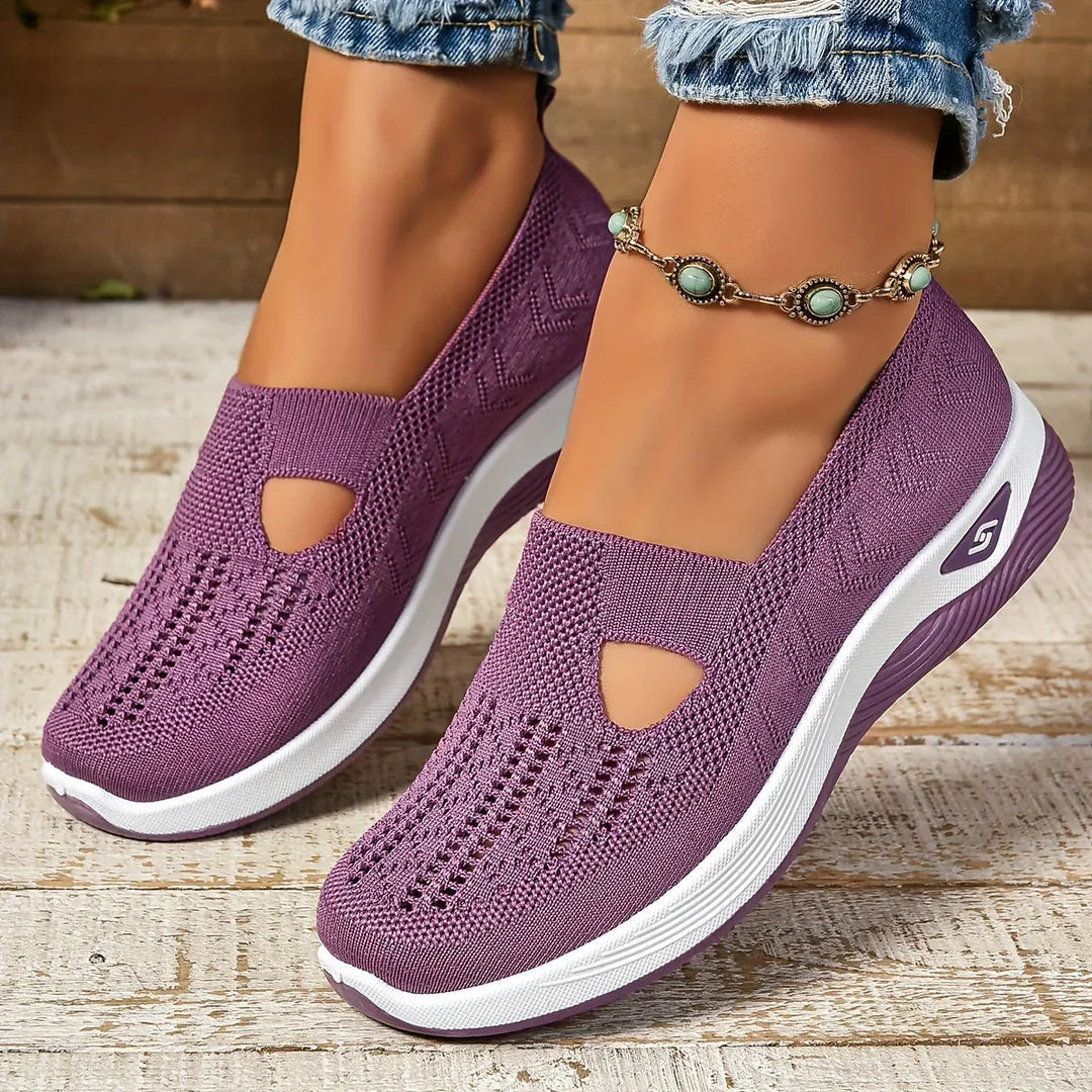 Scarpe ortopediche StrideEase unisex, nere, offrono comfort quotidiano e supporto per camminata.