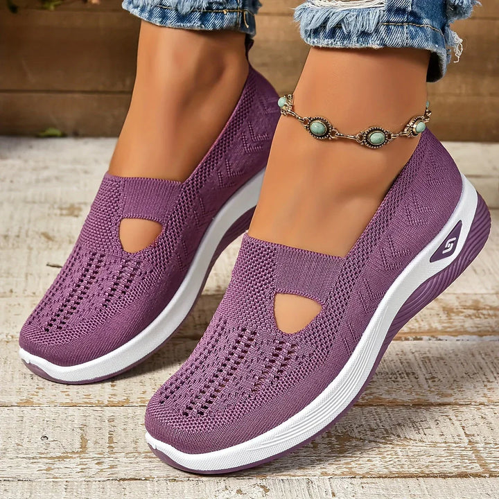 Scarpe ortopediche StrideEase unisex, nere, offrono comfort quotidiano e supporto per camminata.