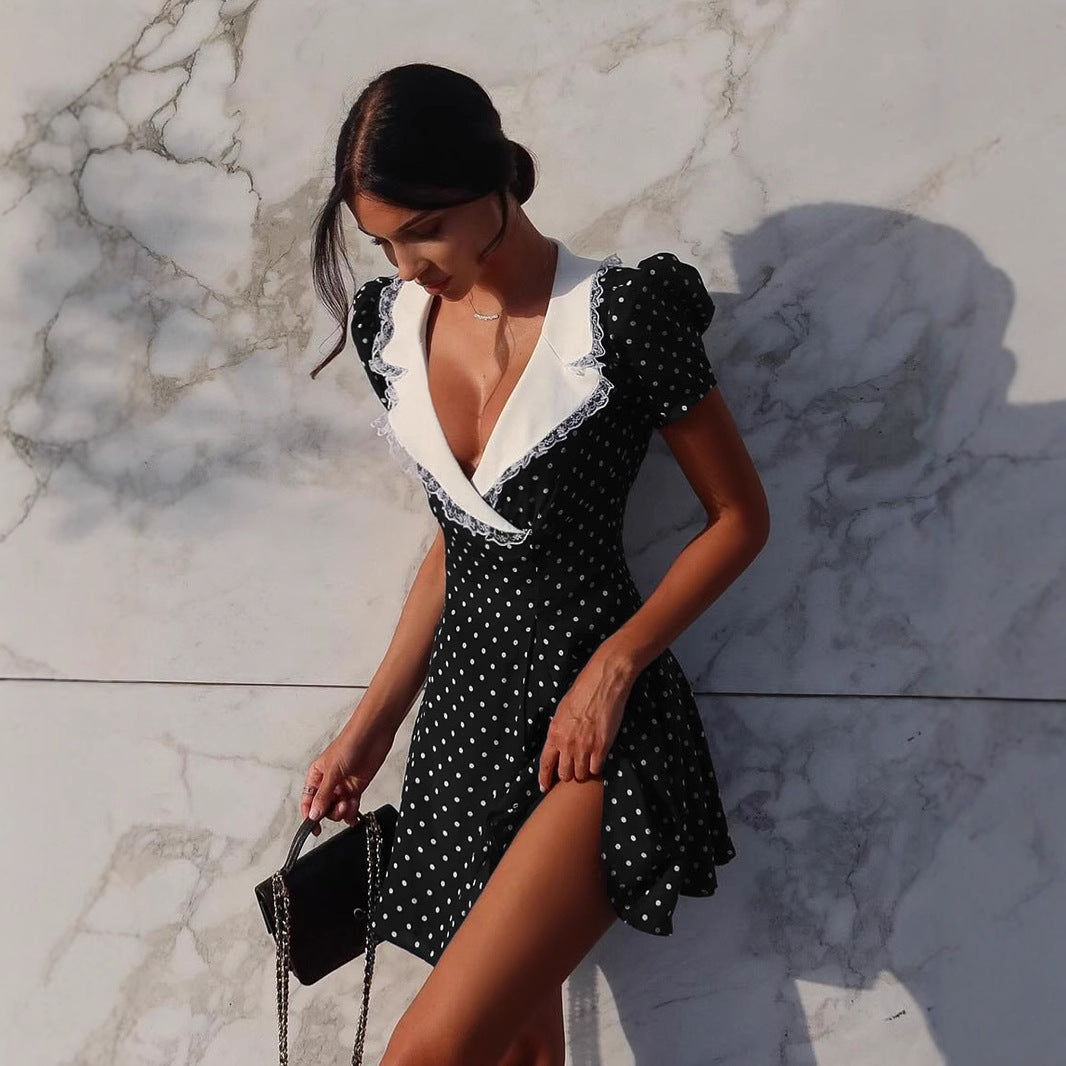 Abito midi donna nero elegante a pois, con maniche a palloncino. Ideale per feste e serate speciali.