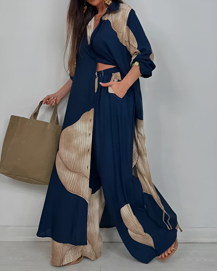 Completo femminile con camicia raffinata e pantaloni a gamba larga, crea un look sofisticato per ogni occasione.