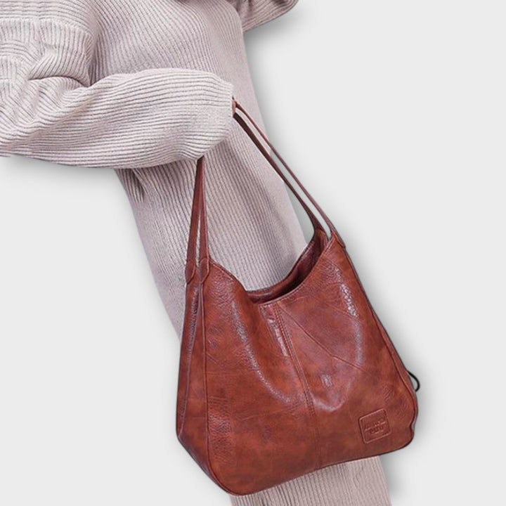Borsa a spalla retrò da donna, classica in similpelle per un look chic e quotidiano.
