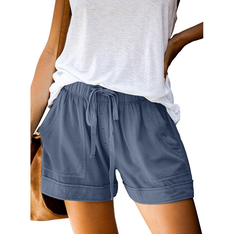 Pantaloncini donna vita alta alla moda, con gamba ampia per un look estivo chic e comodo.