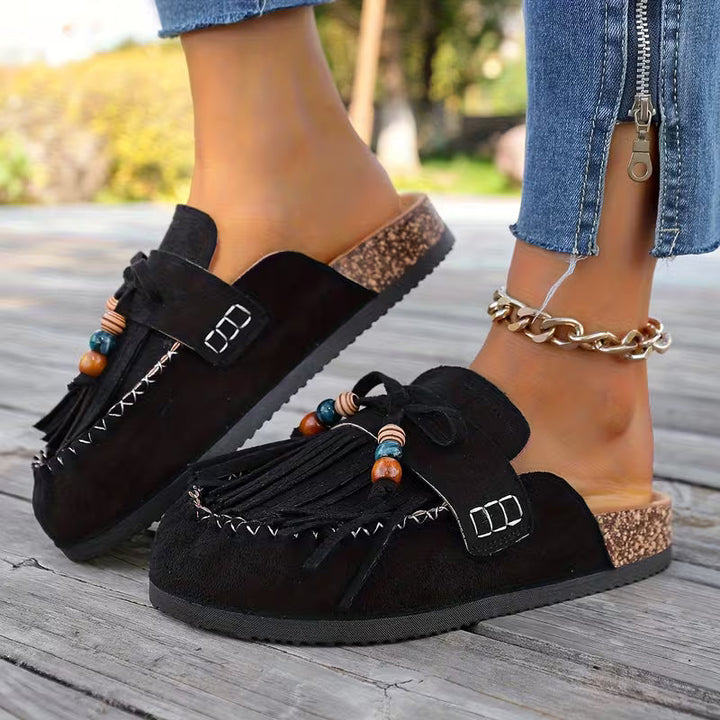 Sandali donna estivi, design boho con nappe decorative, perfetti per un look rilassato e casual.