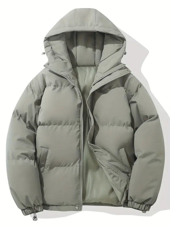 Moderna giacca trapuntata con cappuccio per uomo. Comfort duraturo e stile casual per ogni occasione.