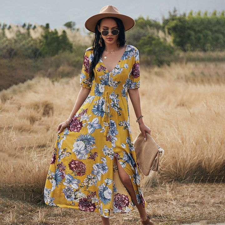 Abito midi estivo donna con scollo a V, stampa floreale e vita alta. Perfetto per la stagione calda.