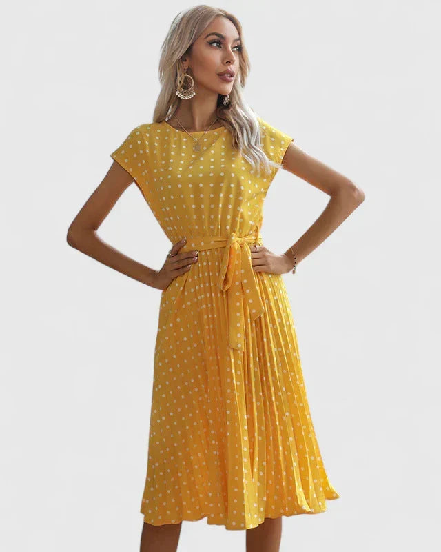 Vestito versatile donna a pois, perfetto per l'ufficio o per serate speciali. Abito elegante e comodo.
