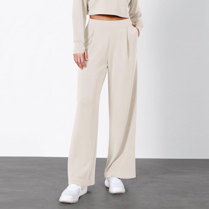 Pantaloni donna a vita alta neri, gamba dritta, drappeggiati. Ideali per look elegante o ufficio.