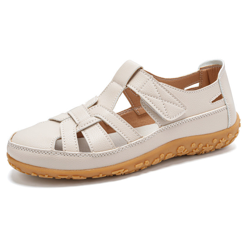 Vista laterale dei sandali donna retrò, con suola flessibile e chiusura a strappo per comfort nei viaggi.