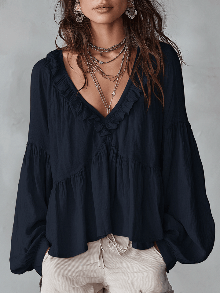 Camicetta romantica con ampi volant, perfetta per un look vintage.