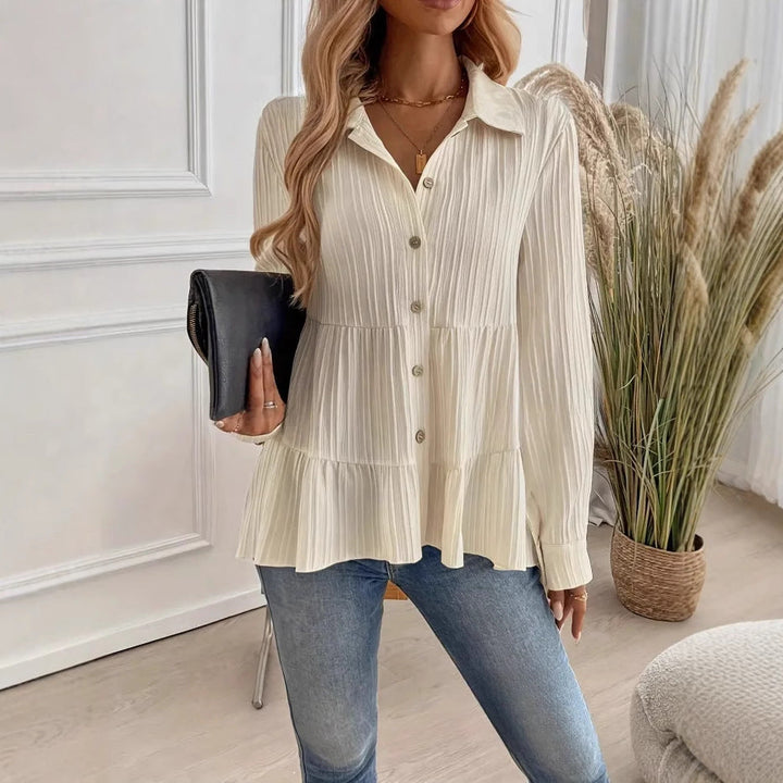 Camicetta bianca lunga da donna con bottoni, per un comfort quotidiano e uno stile casual chic.