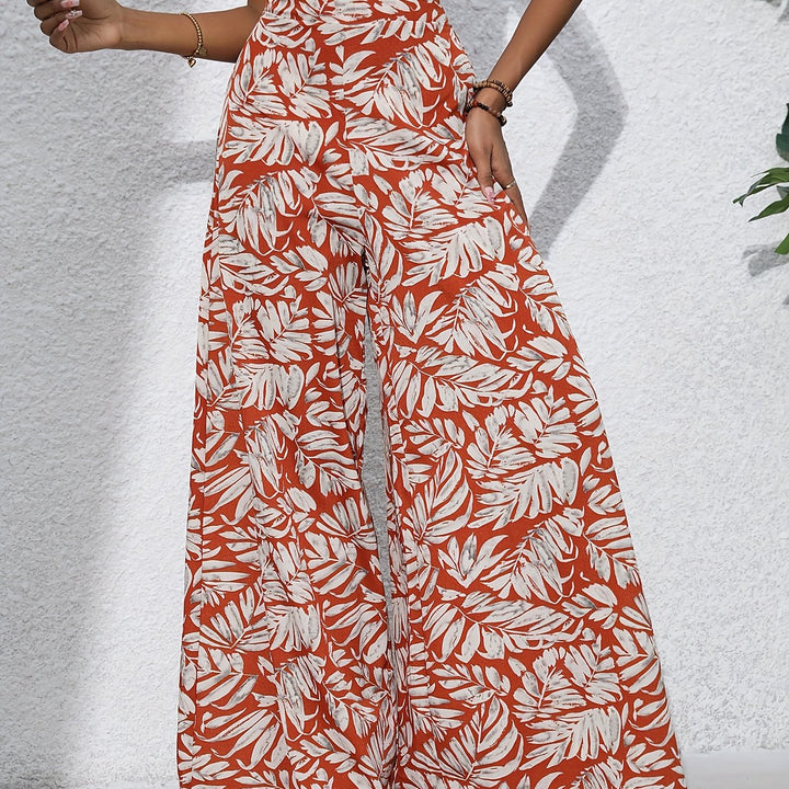 Pantaloni donna casual, gamba larga, vita alta, con fantasia tropicale per un look estivo e confortevole.