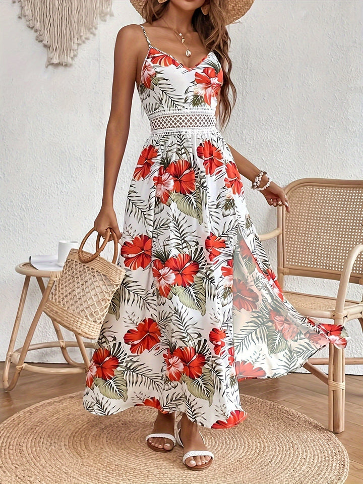 Abito lungo estivo da donna con vivace stampa floreale e spacco laterale elegante.