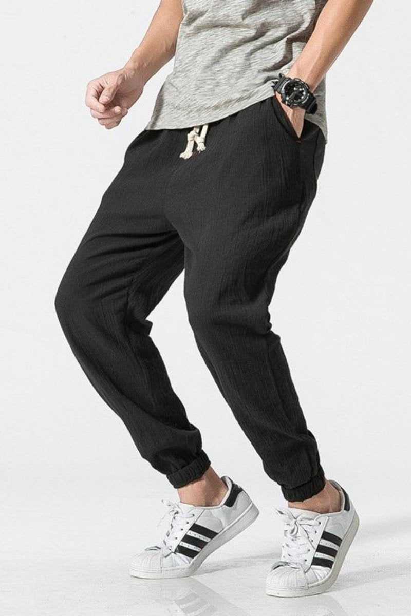 Pantaloni uomo estivi, jogger harem grigi, vestibilità ampia per massimo comfort e stile casual.