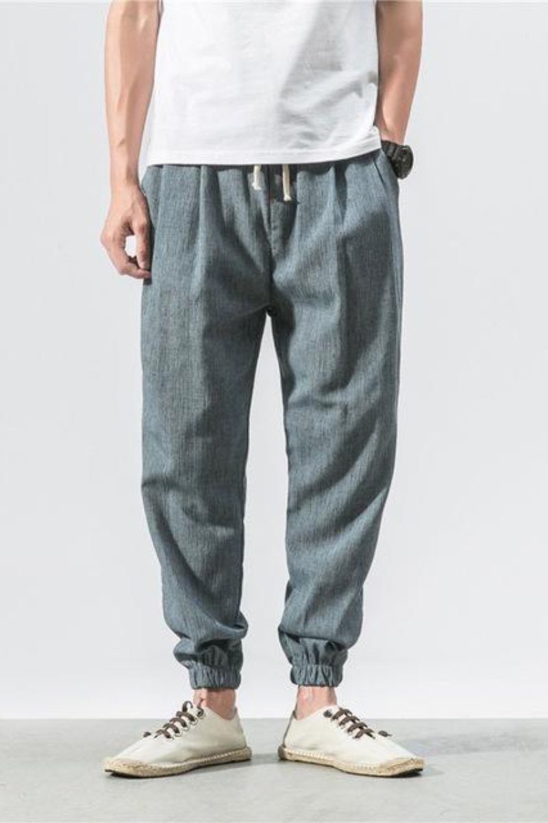 Pantaloni sportivi uomo, jogger harem neri, vita elastica, vestibilità ampia, ideali per danza o casual.