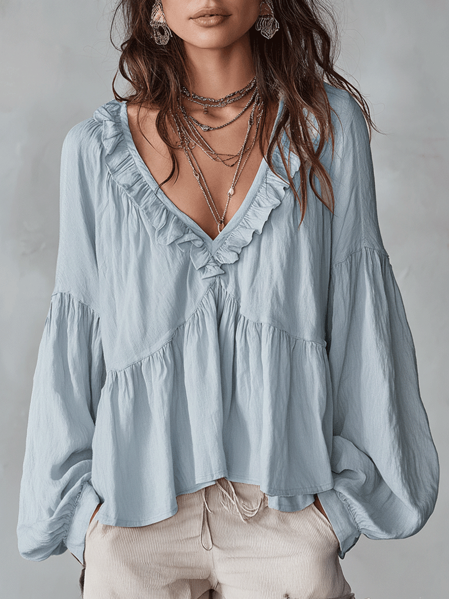 Blusa vintage elegante da donna con dettagli volant e stile leggero.