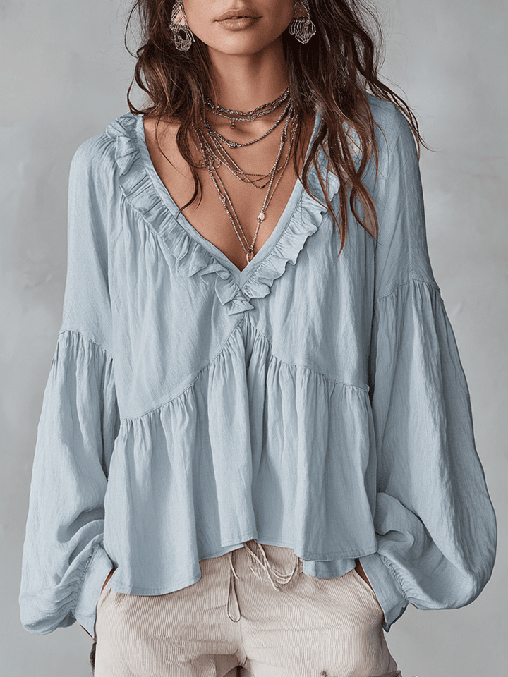 Blusa vintage elegante da donna con dettagli volant e stile leggero.