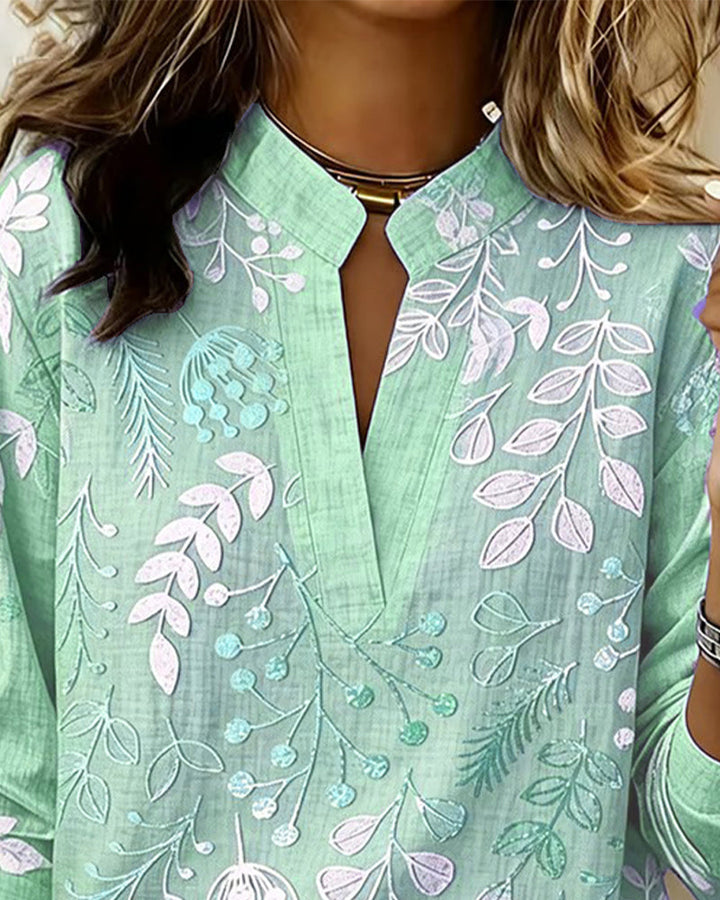Blusa elegante donna, motivo floreale, scollo a V e maniche 3/4. Un must-have per la collezione estiva.