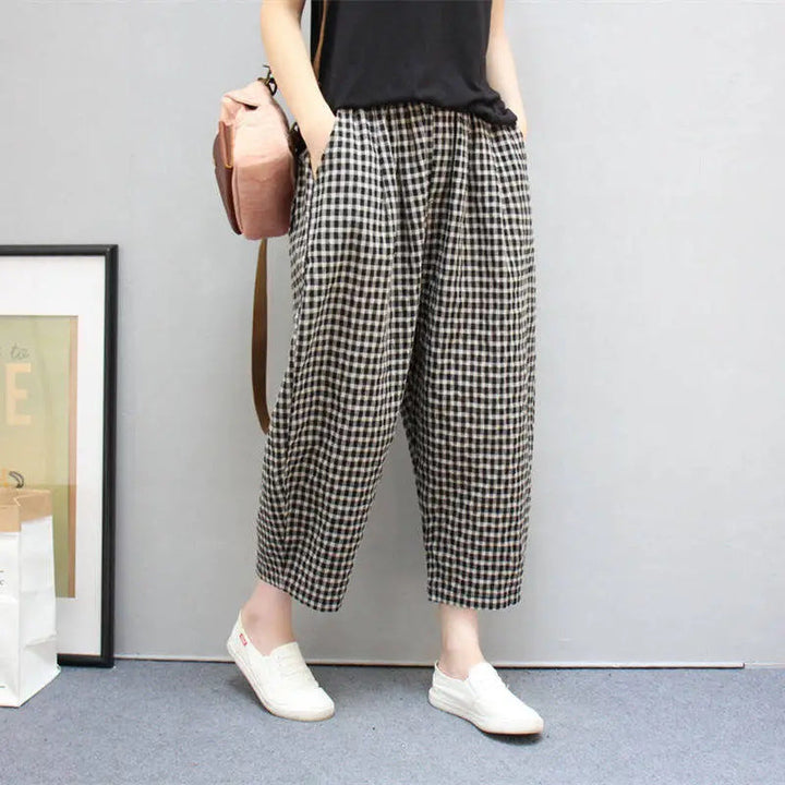 Pantaloni harem donna a vita alta con motivo a quadri, perfetti per look casual ed eleganti primavera autunno.