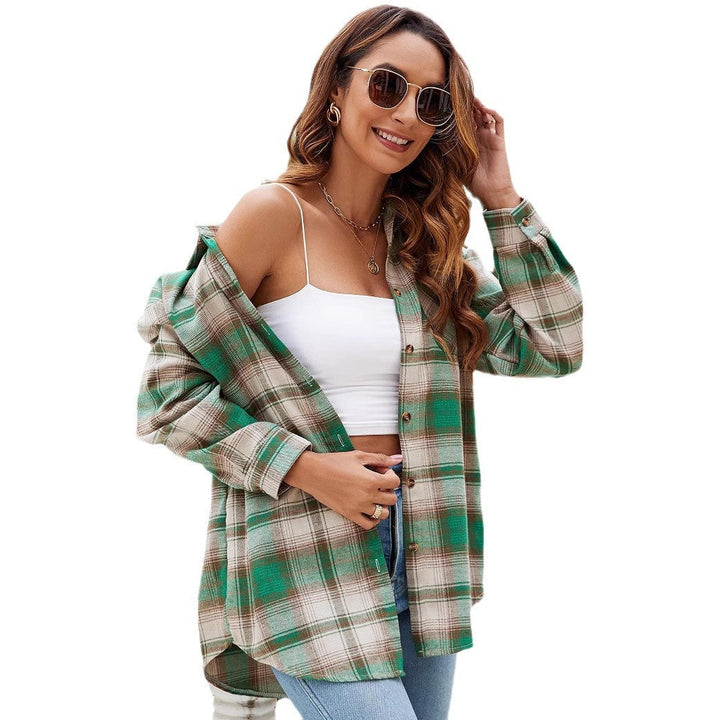 Camicia donna a quadri, taglio lungo e manica lunga. Stile casual versatile, ideale per abbigliamento quotidiano.
