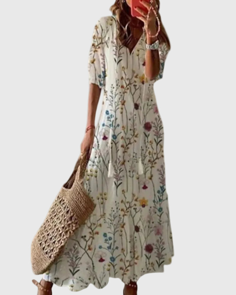 Abito lungo autunnale da donna, stile boho chic e fluido, per un look elegante e confortevole.
