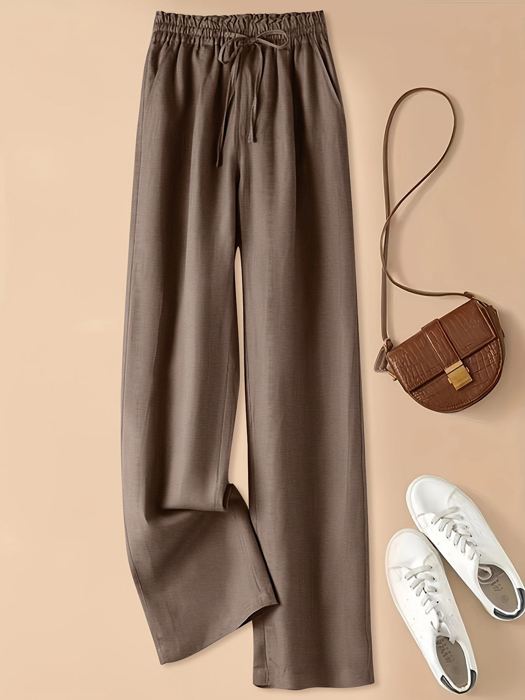 Moda donna: pantaloni casual verde con coulisse, vita alta e tasche, versatili per ogni occasione.