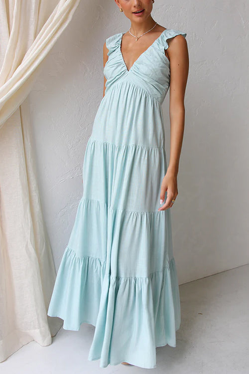 Maxi abito estivo fluido da donna, con profondo scollo a V e delicate balze. Ideale per la moda femminile.