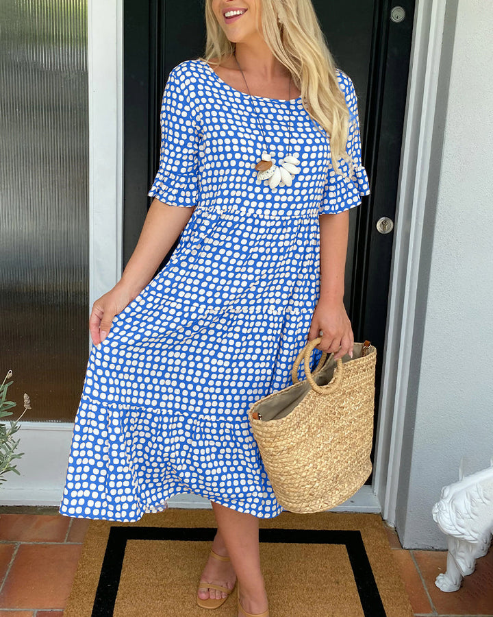 Vestito donna elegante midi a pois, scollo rotondo, ideale per serate estive e comfort.