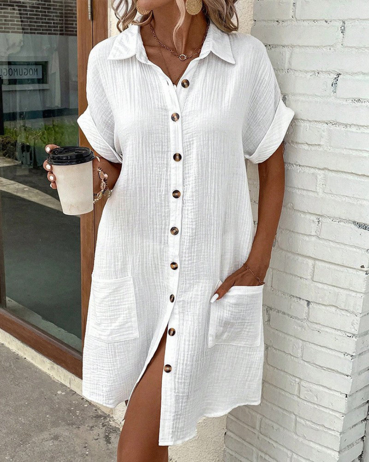 Vestito camicia da donna casual chic, con bottoni frontali e maniche lunghe, ideale per outfit primaverili.