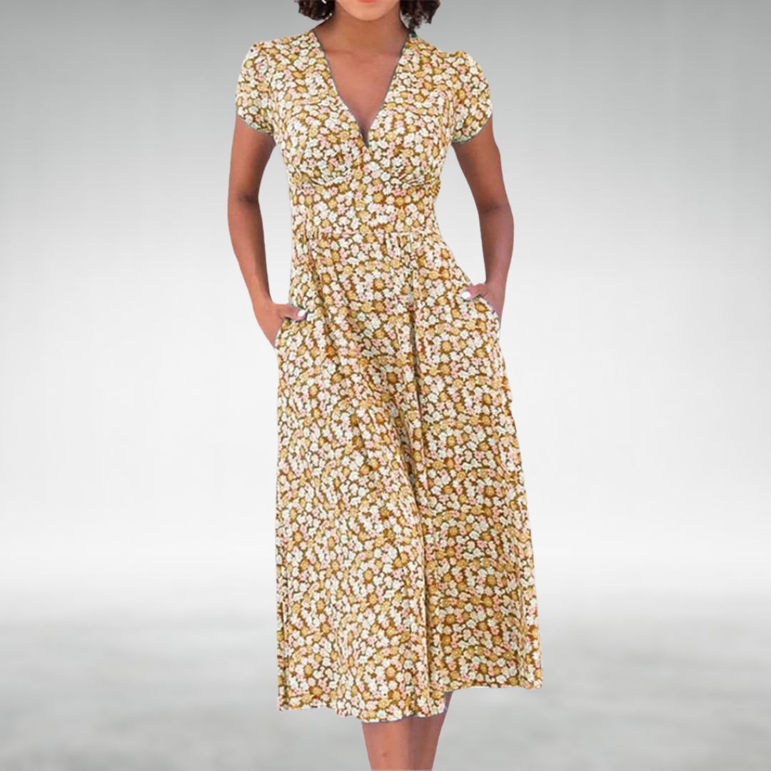 Moda mare donna: vestito estivo a scollo V per vacanze. Tessuto leggero, comodo e trendy per ogni occasione.