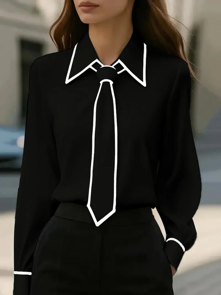 Camicetta donna elegante con abbottonatura frontale, colletto a contrasto e cravatta rimovibile. Moda femminile e chic.