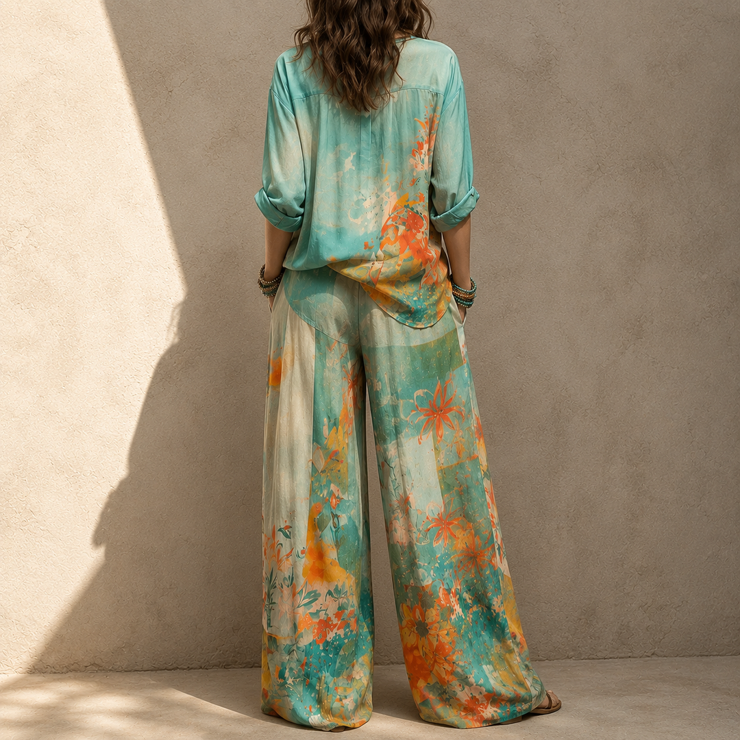 Completo donna coordinato casual-chic blu floreale: top e pantaloni ampi, per moda femminile.