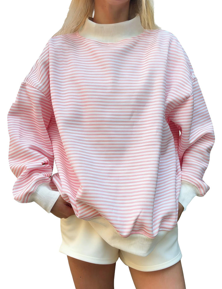 Maglione donna a righe, maniche lunghe, versatile e morbido, per un outfit casual autunnale che unisce moda e comfort.