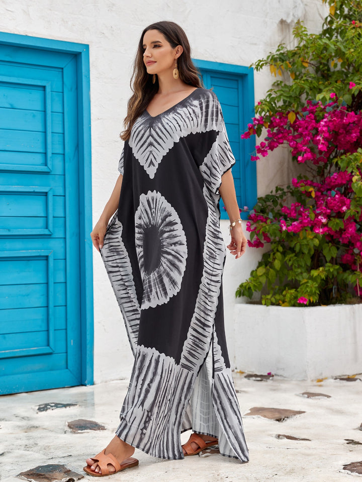Abito lungo stampato donna, scollo a V, ideale per un look da spiaggia rilassato e chic.