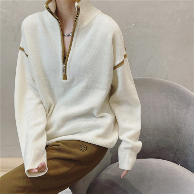 Maglione donna oversize collo coreana con zip, motivi a righe e quadri. Ideale per un look casual autunnale.