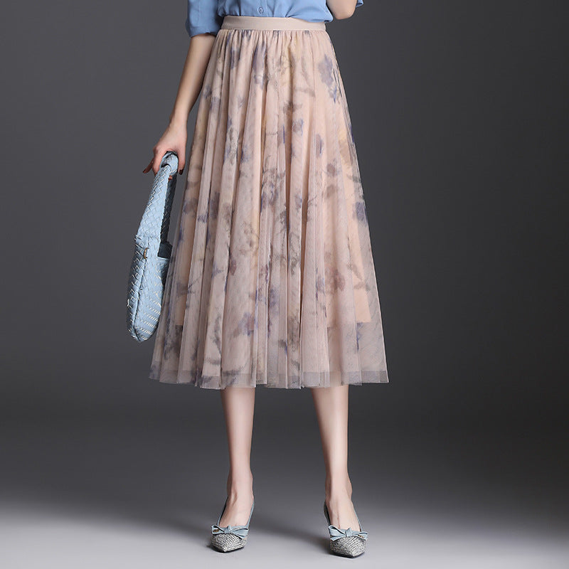 Gonna donna midi a vita alta pieghettata, elegante e versatile, per moda primaverile e autunnale.