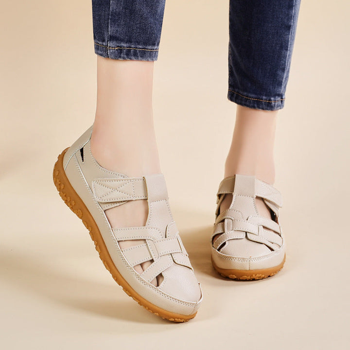 Eleganti sandali donna retrò con cinturino a strappo, ideali per un look estivo casual e alla moda.